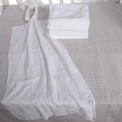 Cotton Gauze Cloth Diaper Inserts 10-Pack displayed with soft white fabric and a plush toy on a crib sheet.